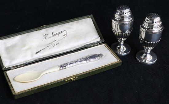 A pair of late Victorian silver pedestal pepperettes by Dobson & Sons, London, 1895 and a cased caviar spoon. 3.75in.